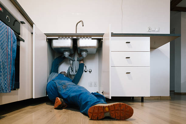 Professional Emergency Plumber technician working in Bentonville, IN